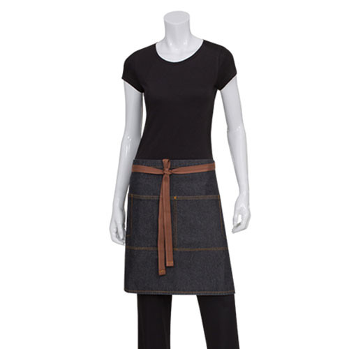 Model wearing dark indigo denim half waist apron with tan leather-look tie straps and contrast stitching