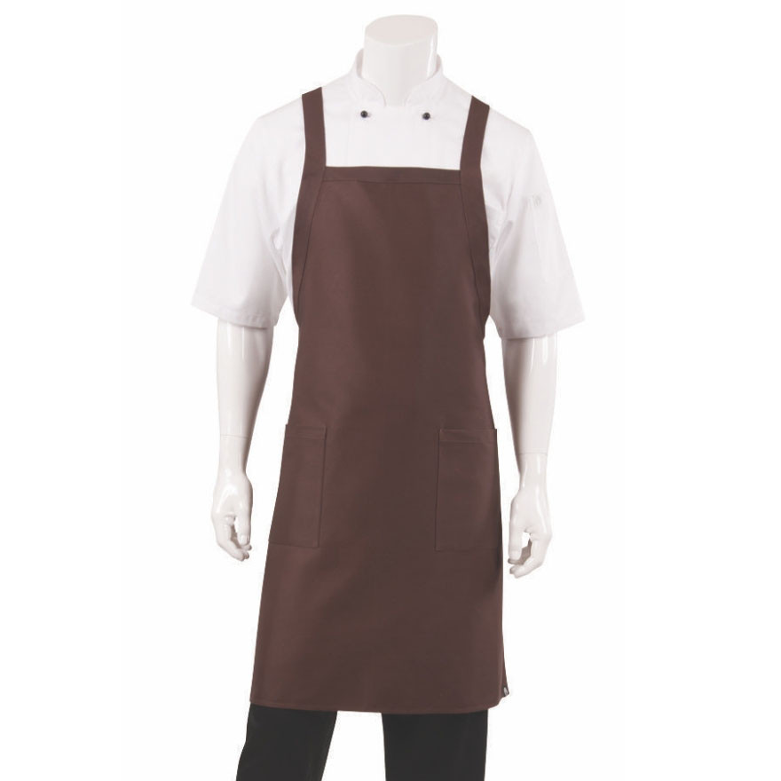 Chocolate brown crossover back bib apron with front pockets worn over white shirt