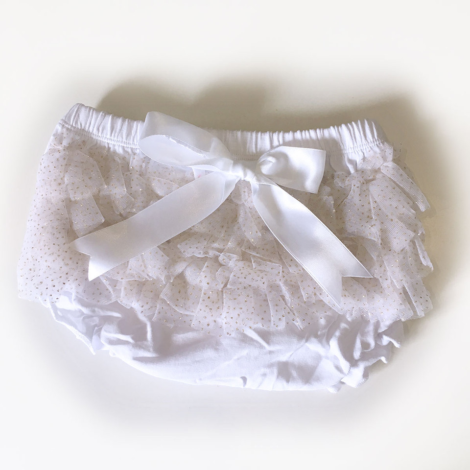 White satin baby bloomers with layered chiffon ruffles and decorative satin bow at waistband