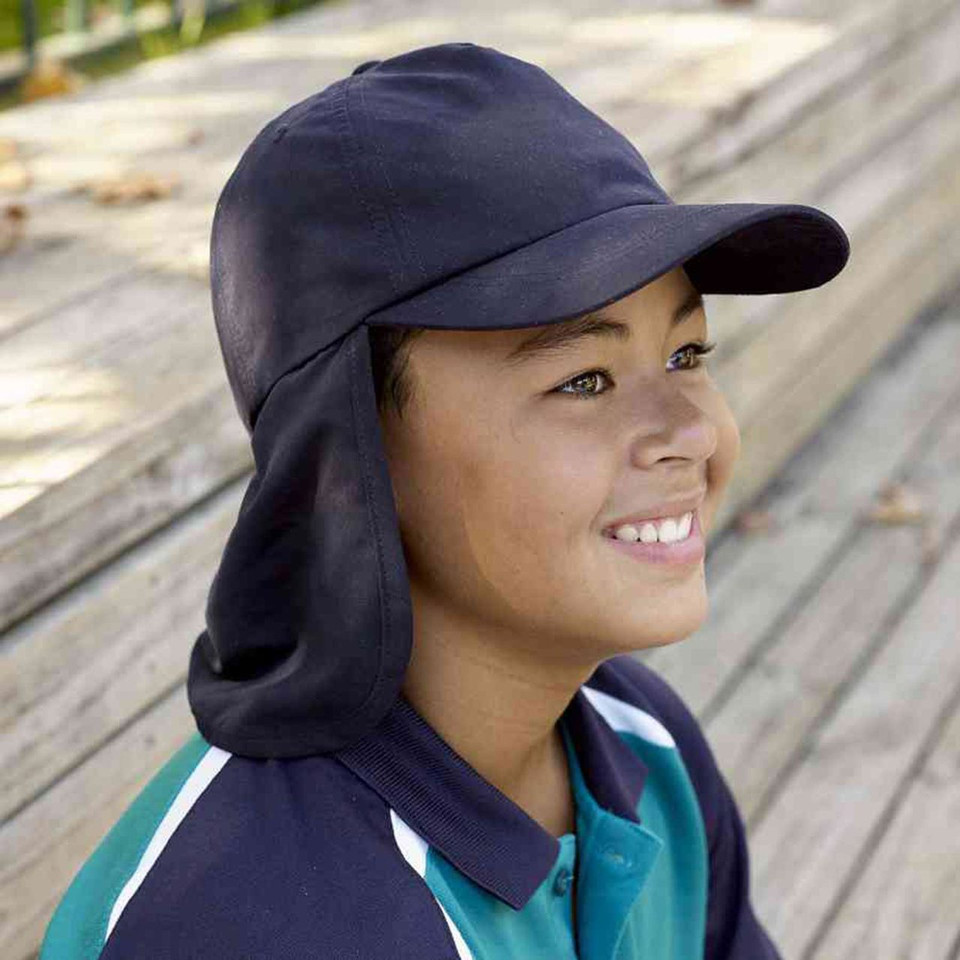 Navy microfibre legionnaire cap with neck flap and curved brim worn by smiling child
