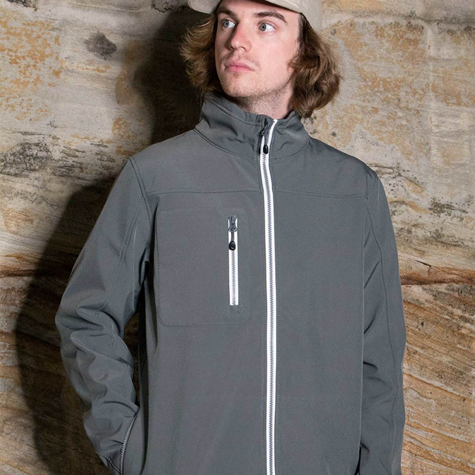Charcoal grey softshell jacket with white contrast zip and chest pocket detail
