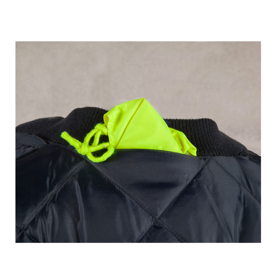 Close-up of black quilted flying jacket with packable fluorescent yellow hood stored in ribbed collar
