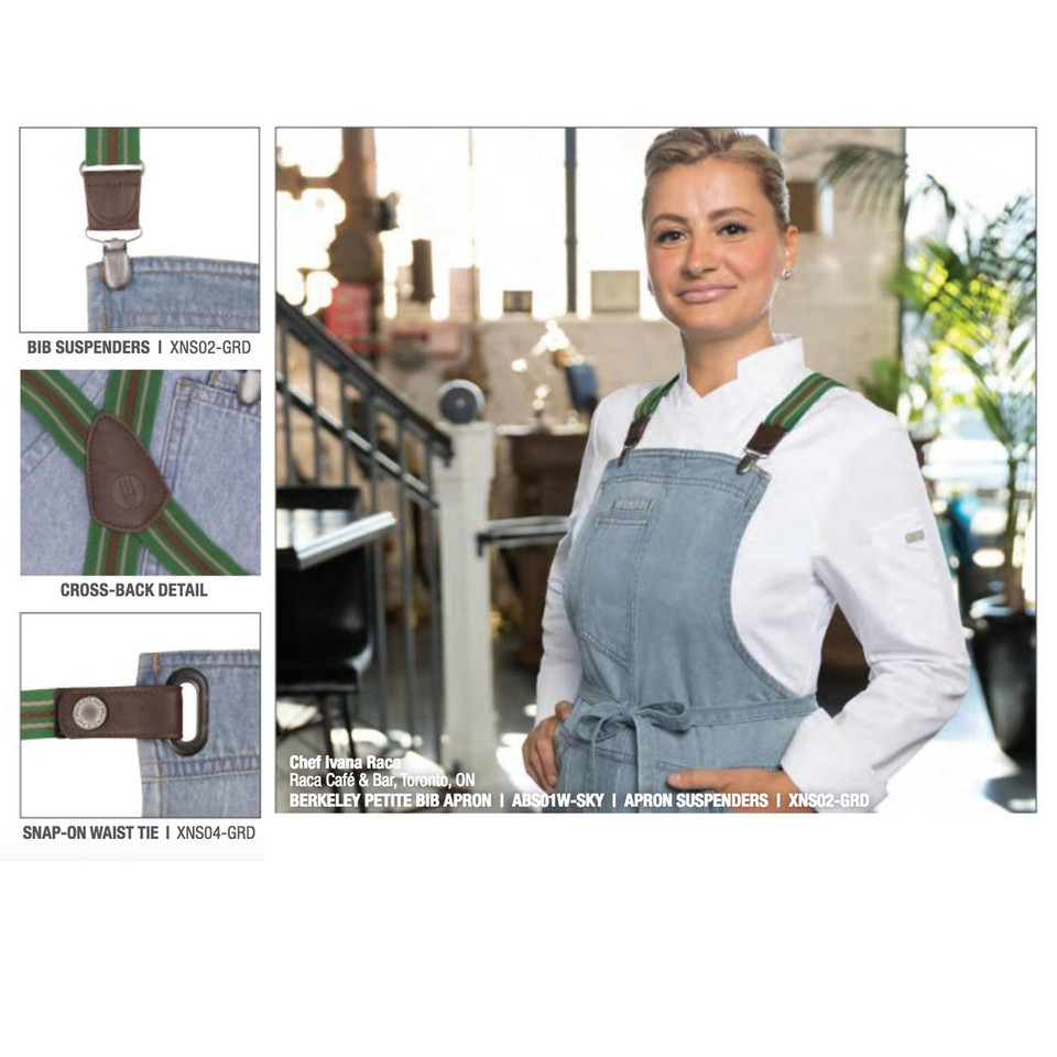 Chef wearing sky blue denim-look full bib apron with green cross-back suspenders and snap-on waist tie in café setting