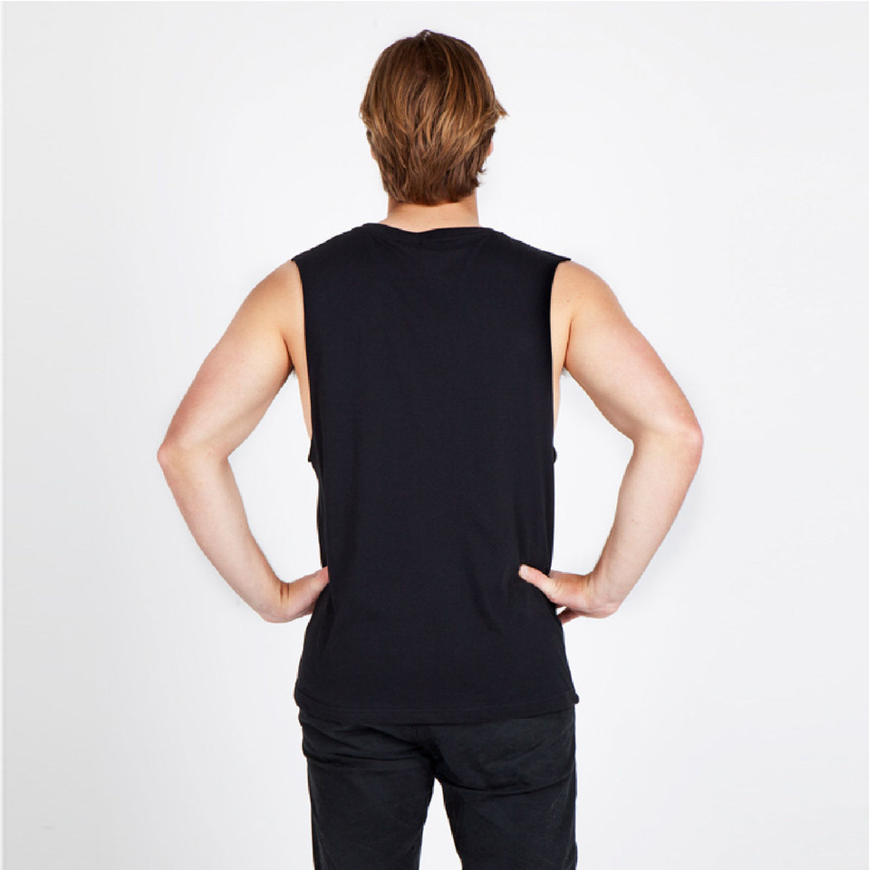 Male model wearing black sleeveless muscle tee, back view showing low-cut armholes and relaxed fit