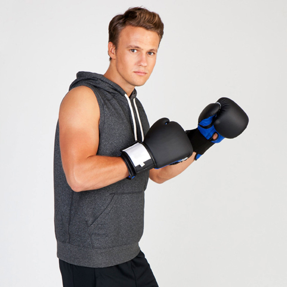 Male model in charcoal marle sleeveless hoodie with drawstring hood, kangaroo pocket, boxing stance