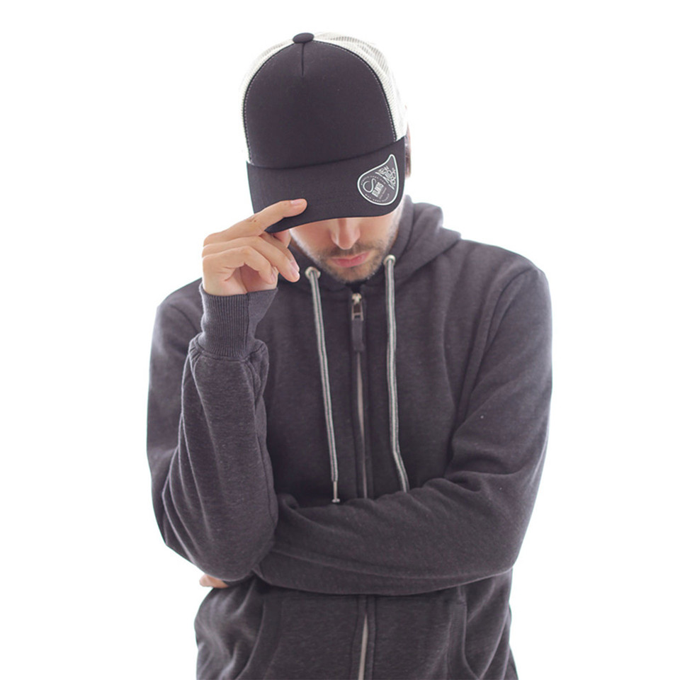 Navy and white two-tone trucker cap with mesh back panels and adjustable snapback closure