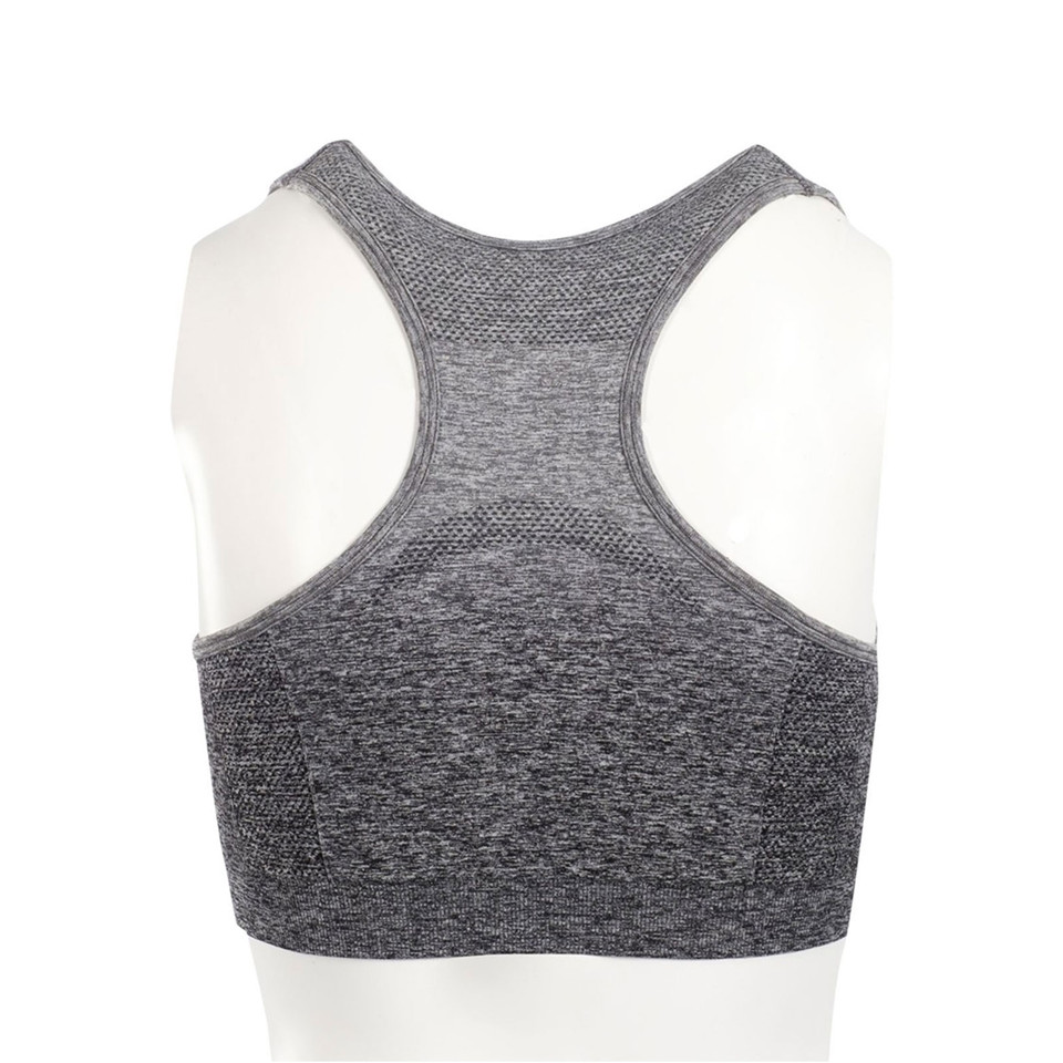 Charcoal grey seamless sports crop top with racer back design and textured knit panels