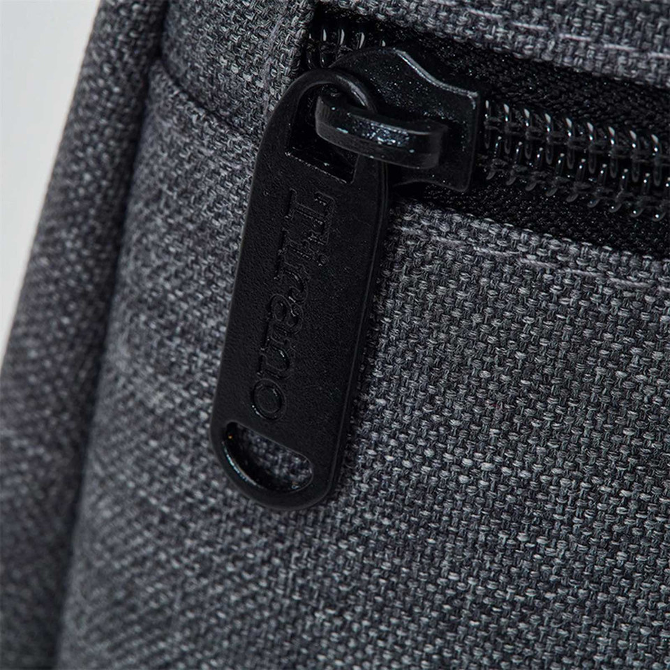 Charcoal grey wine cooler bag with black branded zipper pull detail on textured fabric