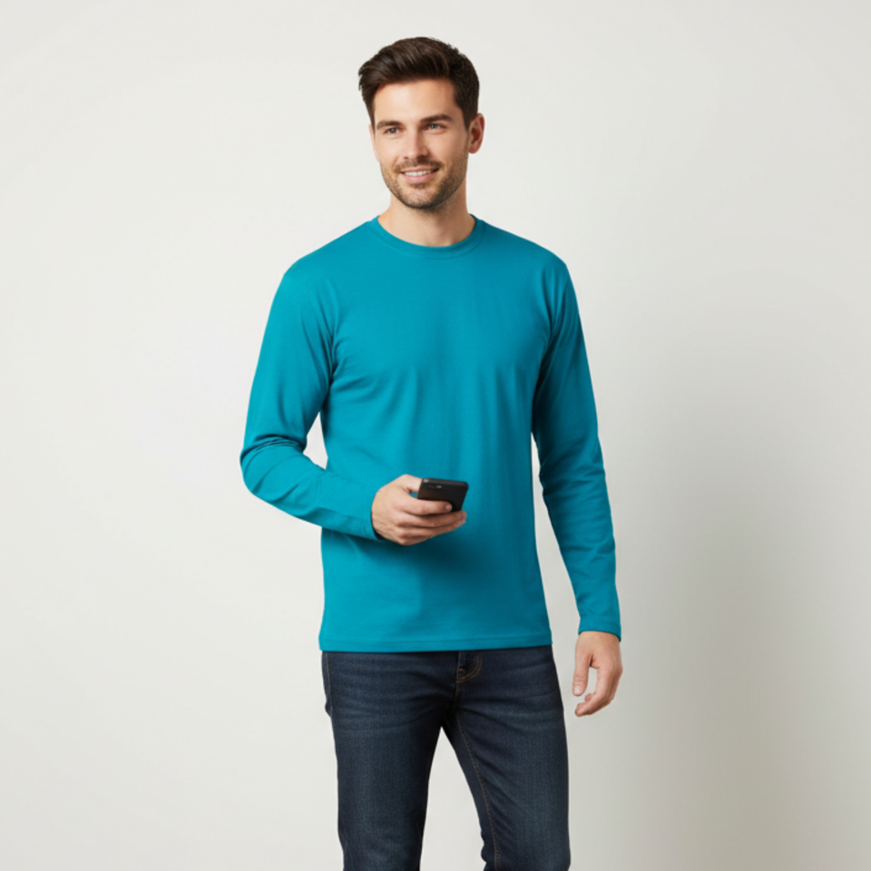 Male model wearing the Apollo Unisex Plain Polyester Long Sleeve T-Shirt in Cyan