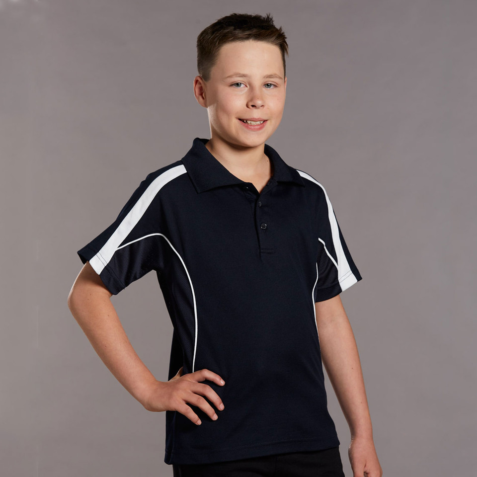 Boy wearing navy and white contrast panel short sleeve polo with button placket and shoulder inserts