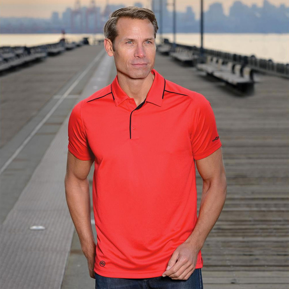 Bright coral polo shirt with navy contrast piping on collar and placket, short sleeves