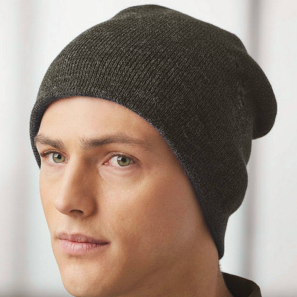 Man wearing a black marl Nordic Plain Marl Double Layer Slouch Beanie, perfect for warmth and style.