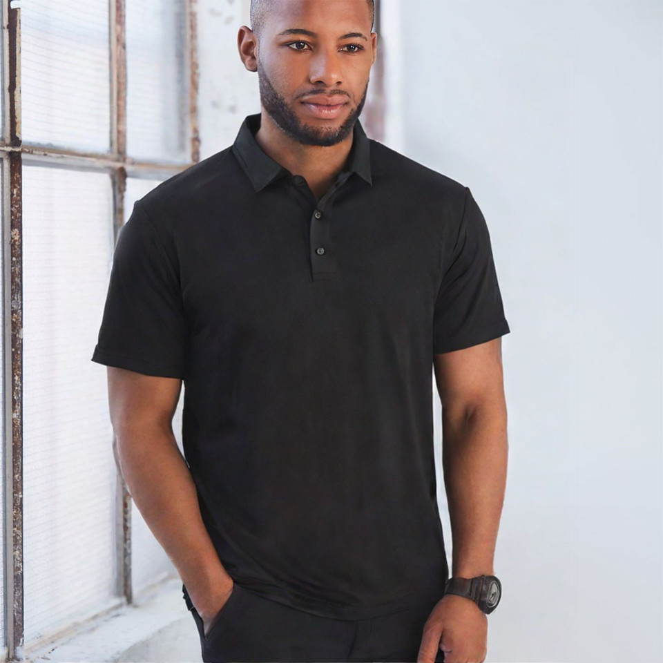 Man wearing a black short sleeve polo shirt with three-button placket and smooth CoolDry fabric