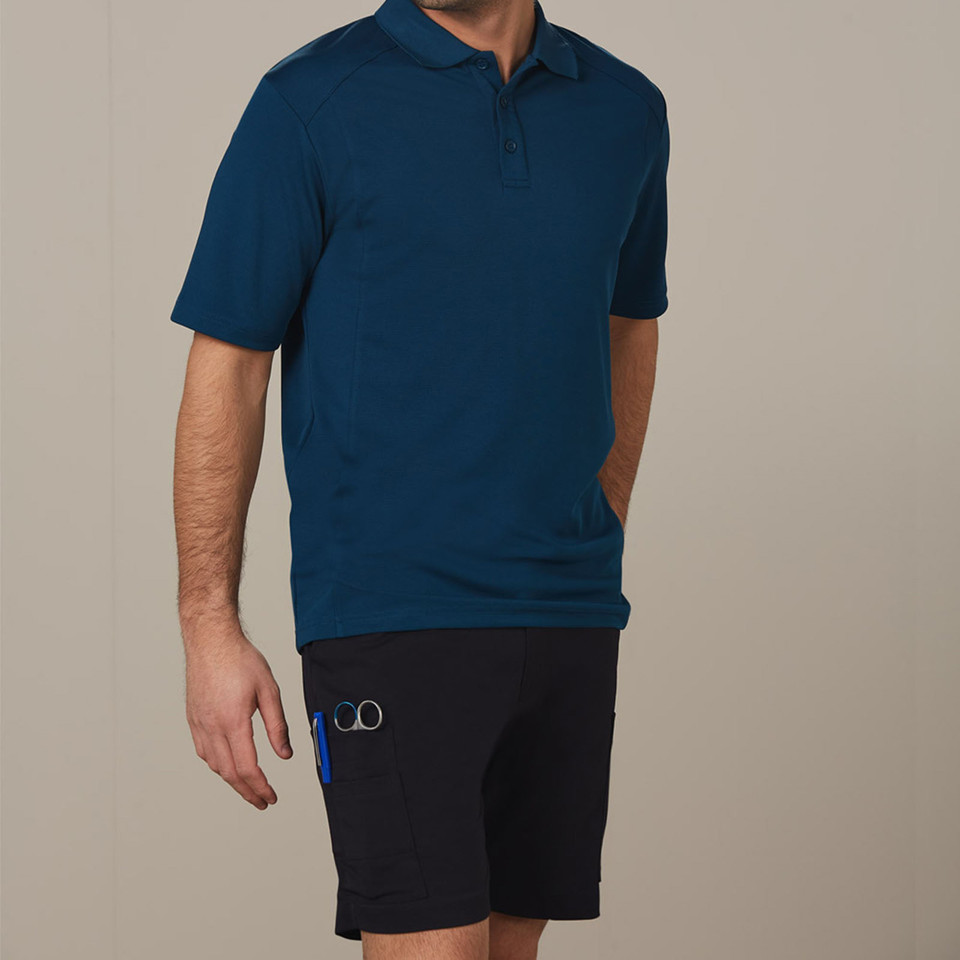 Navy blue polo shirt with collar and button placket paired with black cargo shorts