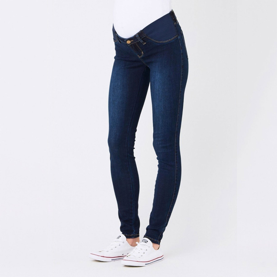 Dark indigo maternity jeggings with belly panel, button fly, and slim ankle-grazing fit