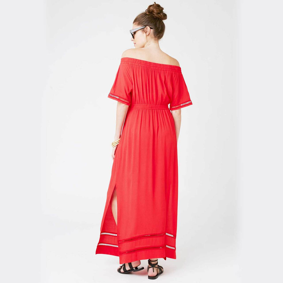 Model wearing red off-shoulder maxi dress with elasticated waist, flutter sleeves, lace trim hem and side split