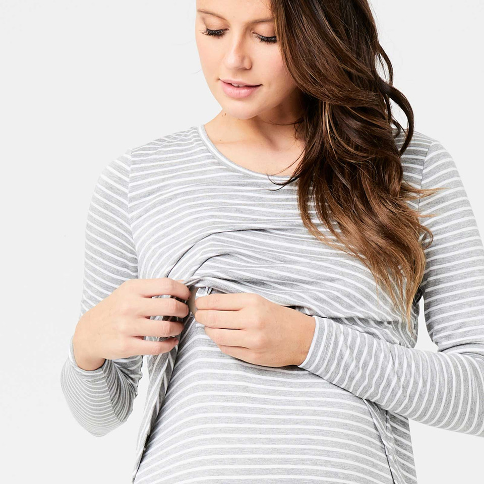 Pregnant model demonstrating nursing access on grey and white stripe long sleeve maternity top