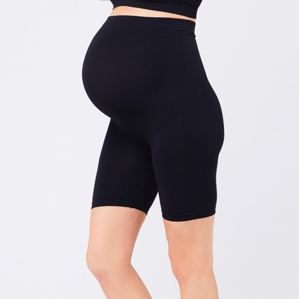 Black maternity support shorts with high waistband and mid-thigh length in seamless construction
