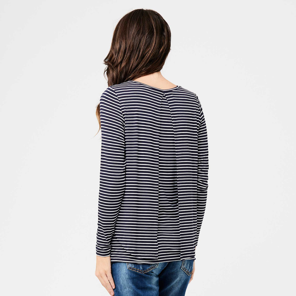 Model wearing navy and white striped long sleeve nursing top, rear view showing swing back hem
