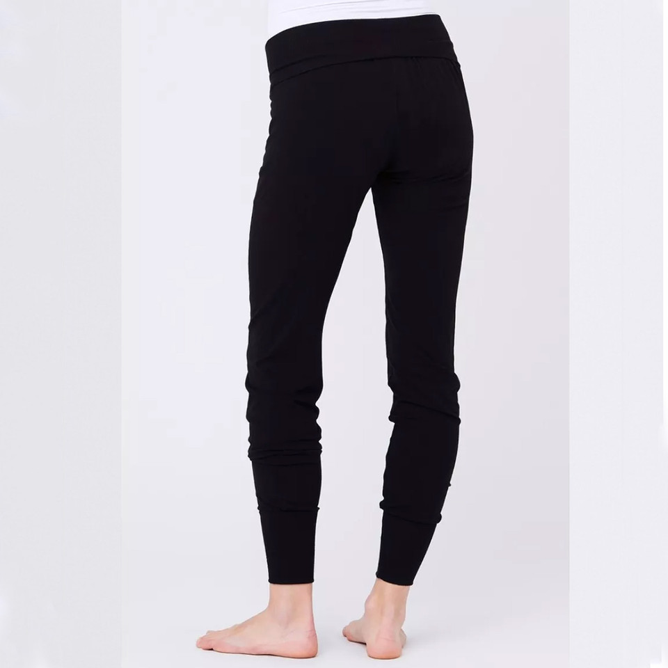 Model wearing black maternity lounge pants with wide fold-over waistband and tapered ribbed cuffs, rear view