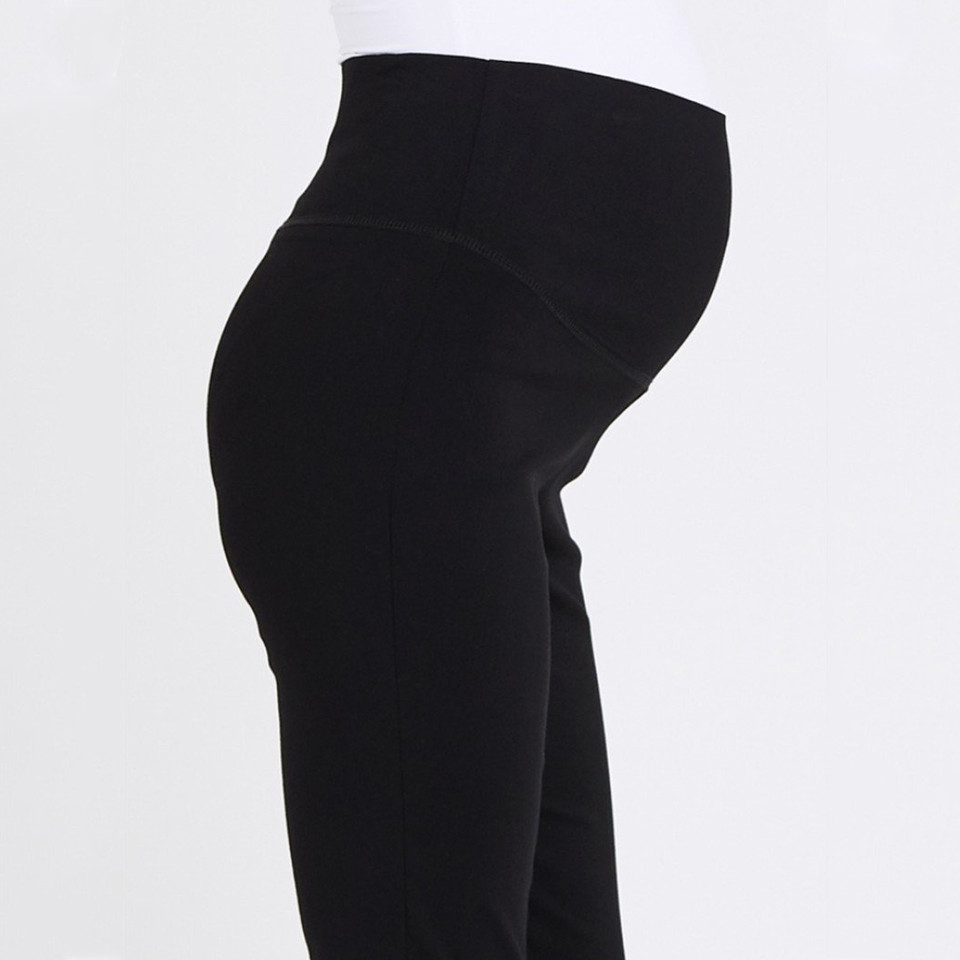 Black maternity capri pants with wide fold-over waistband shown in side profile view