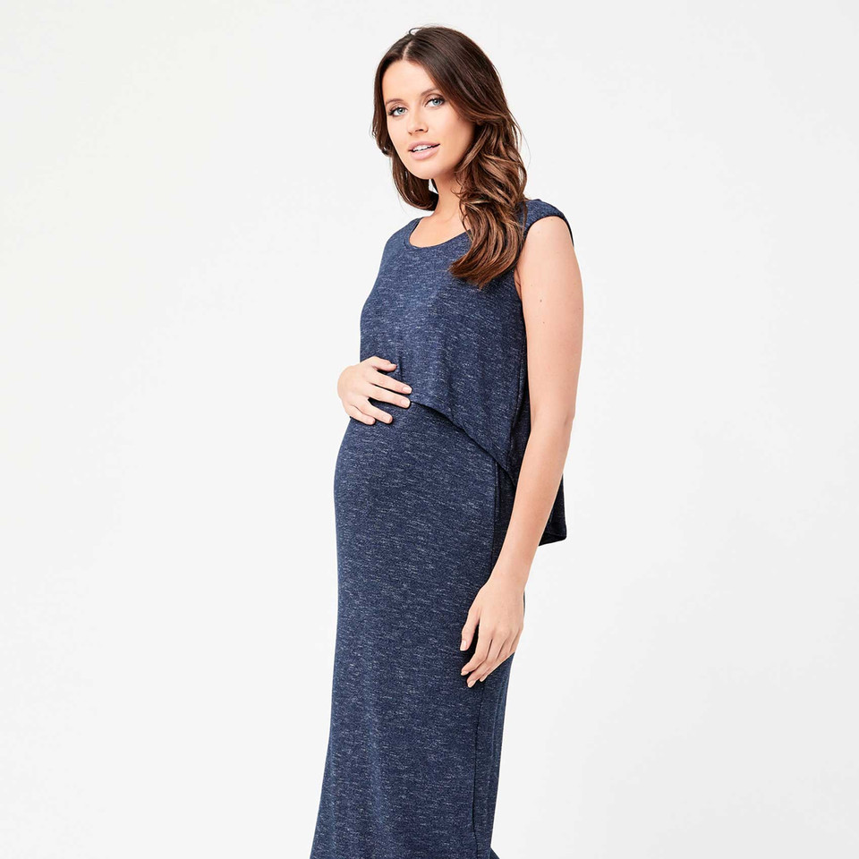 Pregnant model wearing a navy marl sleeveless maxi dress with layered swing back panel