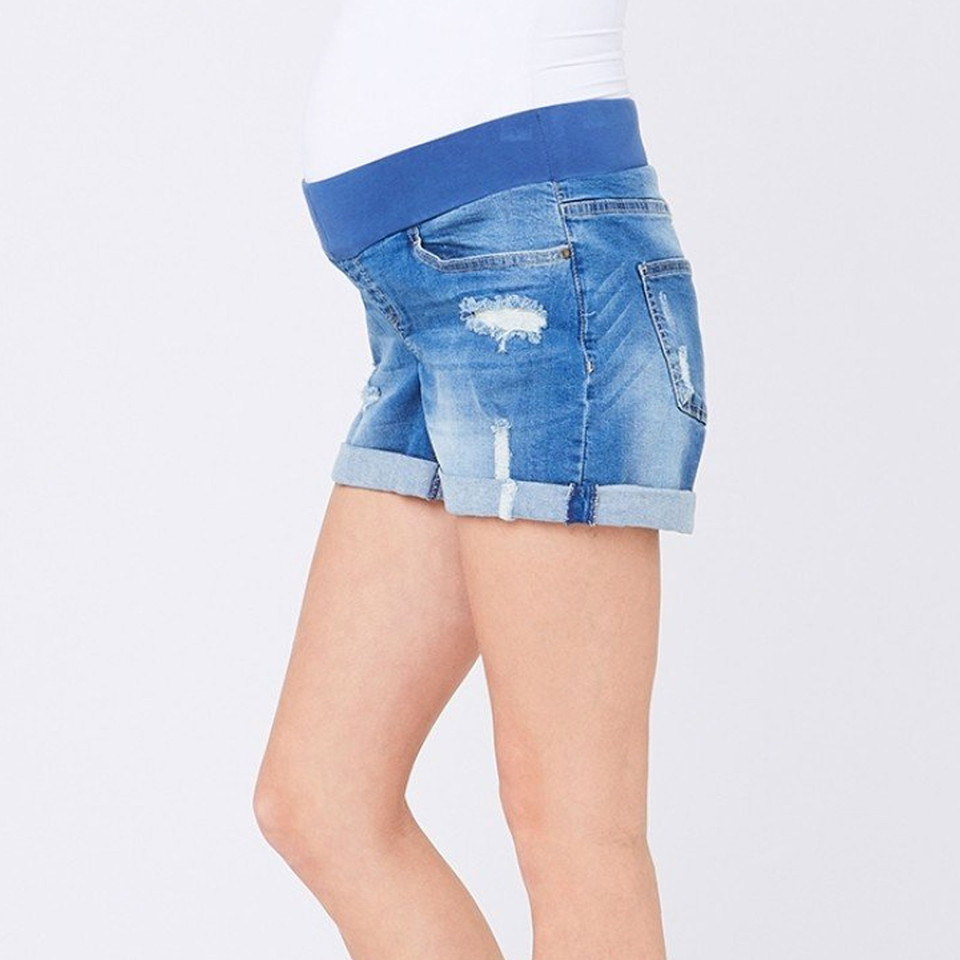 Light blue distressed denim maternity shorts with rolled cuffs and stretch waistband panel