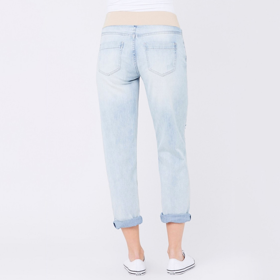 Rear view of light wash boyfriend maternity jeans with fold-up cuffs, stretch waistband, and twin back pockets on model