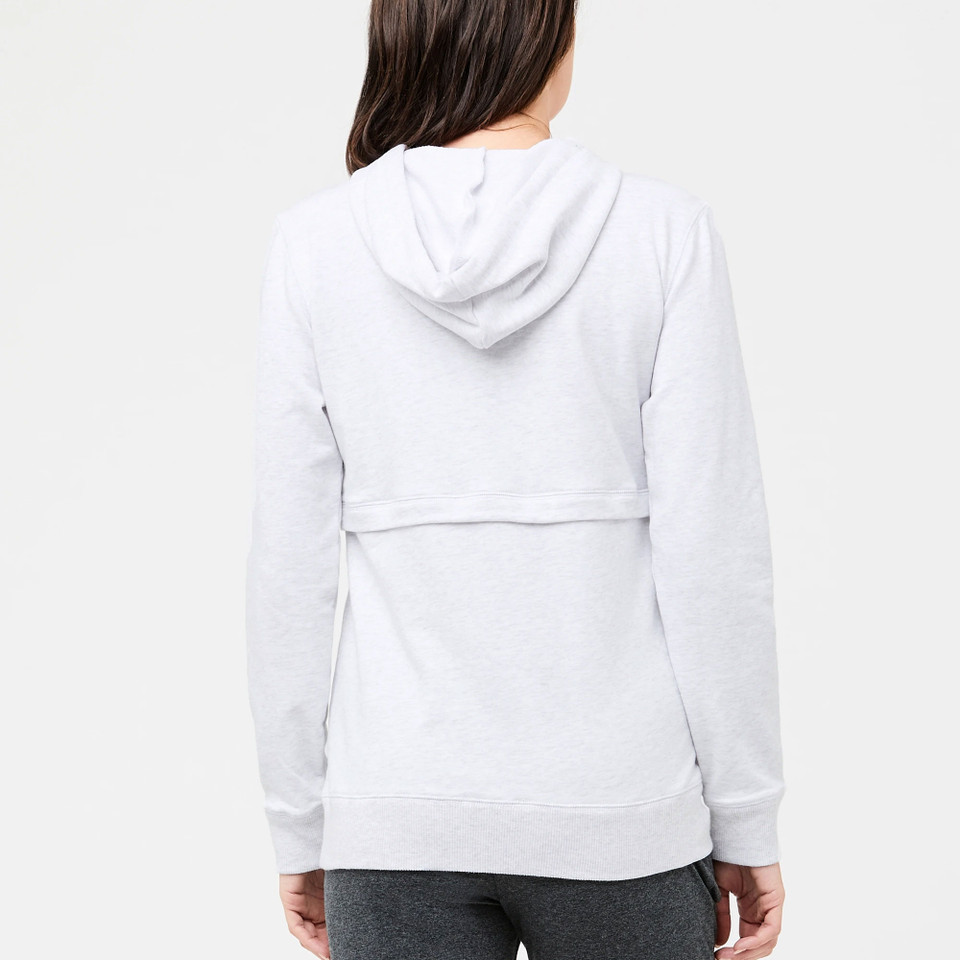 Woman wearing light grey marle nursing hoodie with hidden back panel and ribbed cuffs, rear view