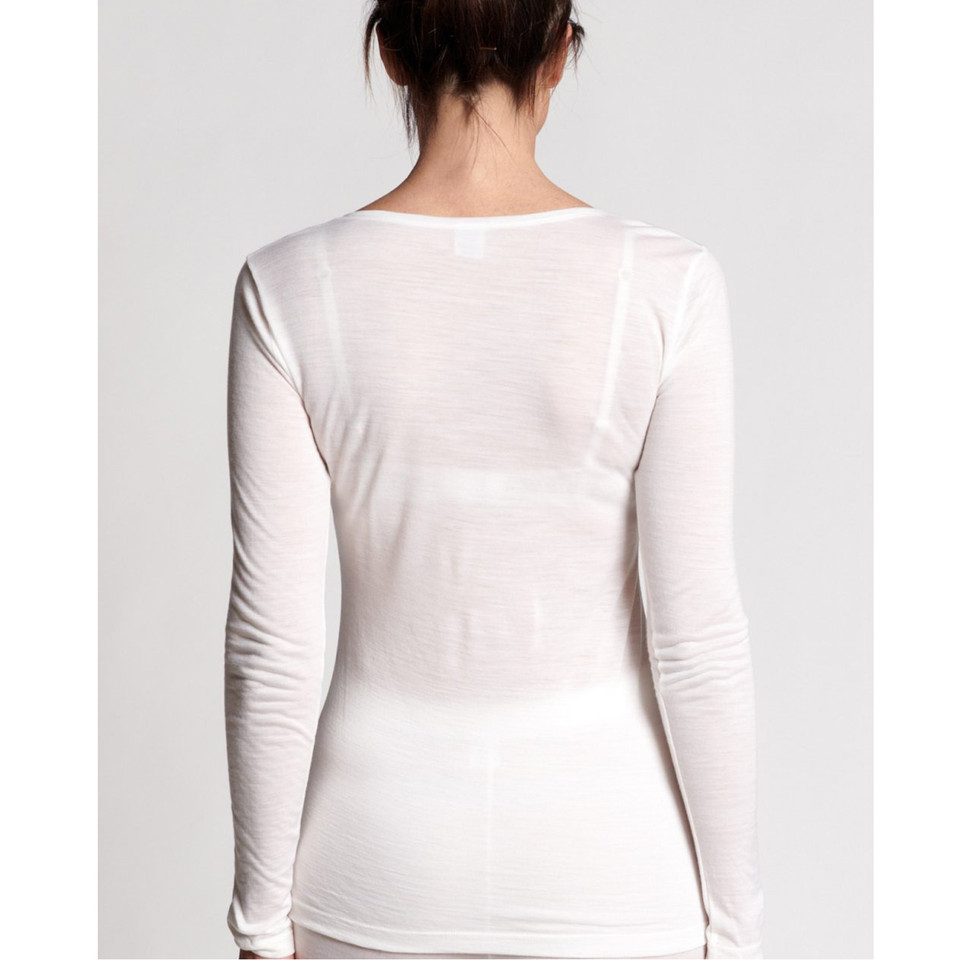 Back view of white long sleeve women's tee in soft E Wool Lyocell blend with wide boat neckline