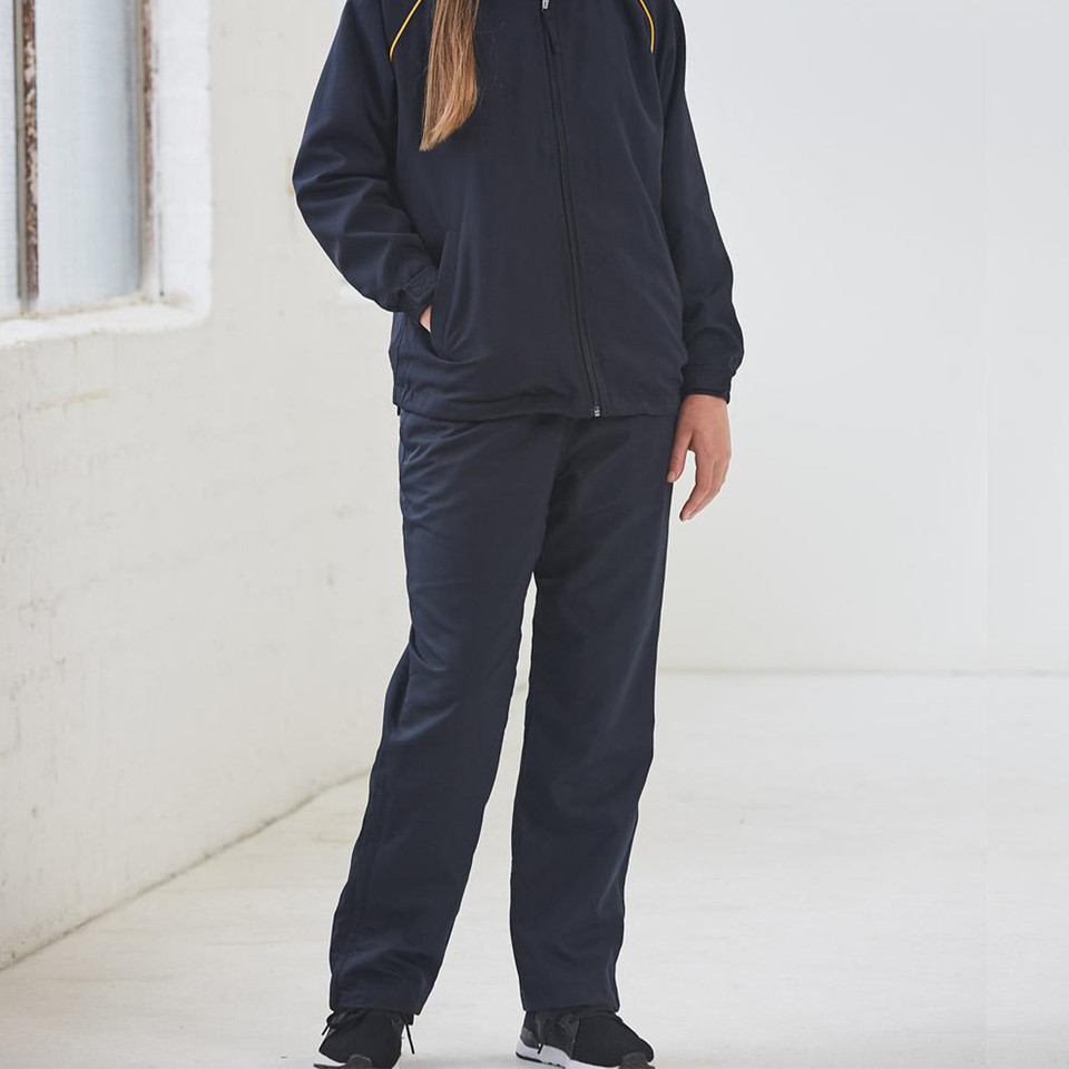 Child wearing navy polyester track pants with matching navy and gold zip jacket, straight leg fit