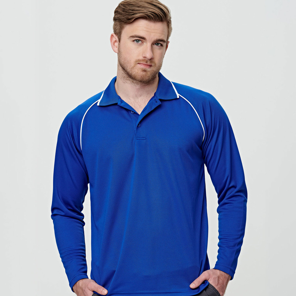 Man wearing royal blue long sleeve polo with white contrast piping along raglan sleeves and collar