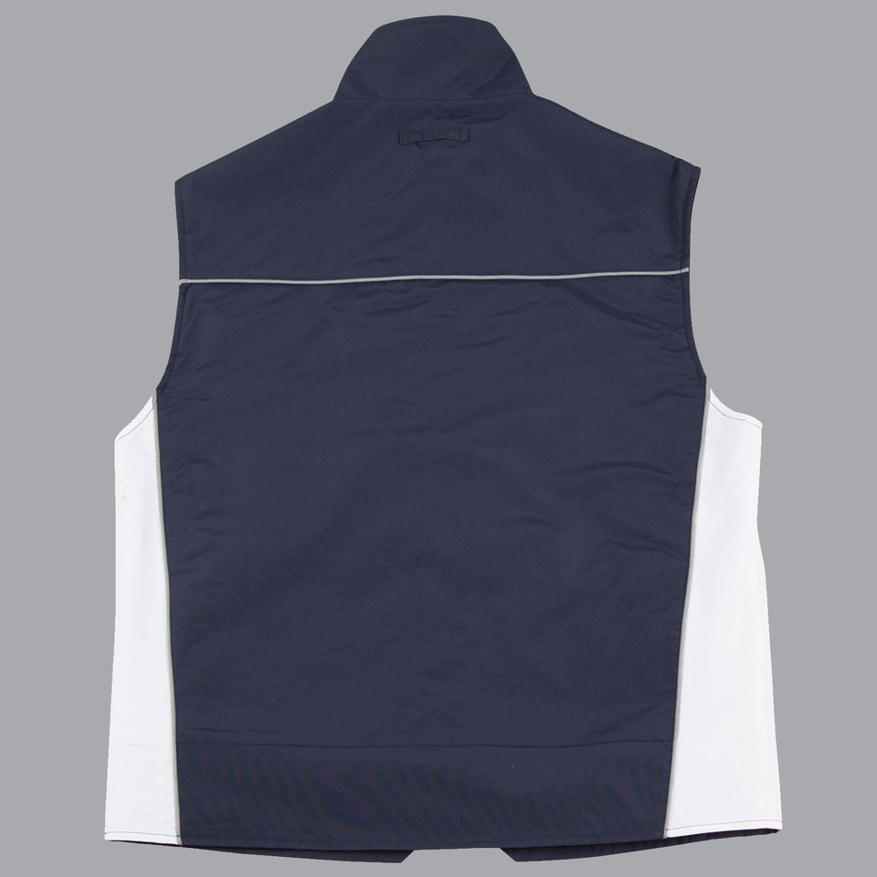 Back view of navy and white sleeveless vest with contrast side panels and reflective shoulder piping
