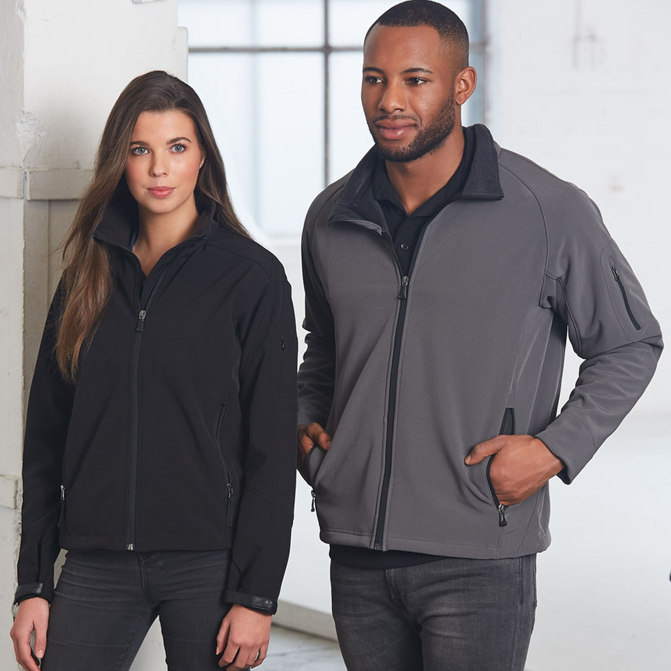 Charcoal grey softshell jacket with black collar and sleeve pocket detail, paired with black women's softshell jacket