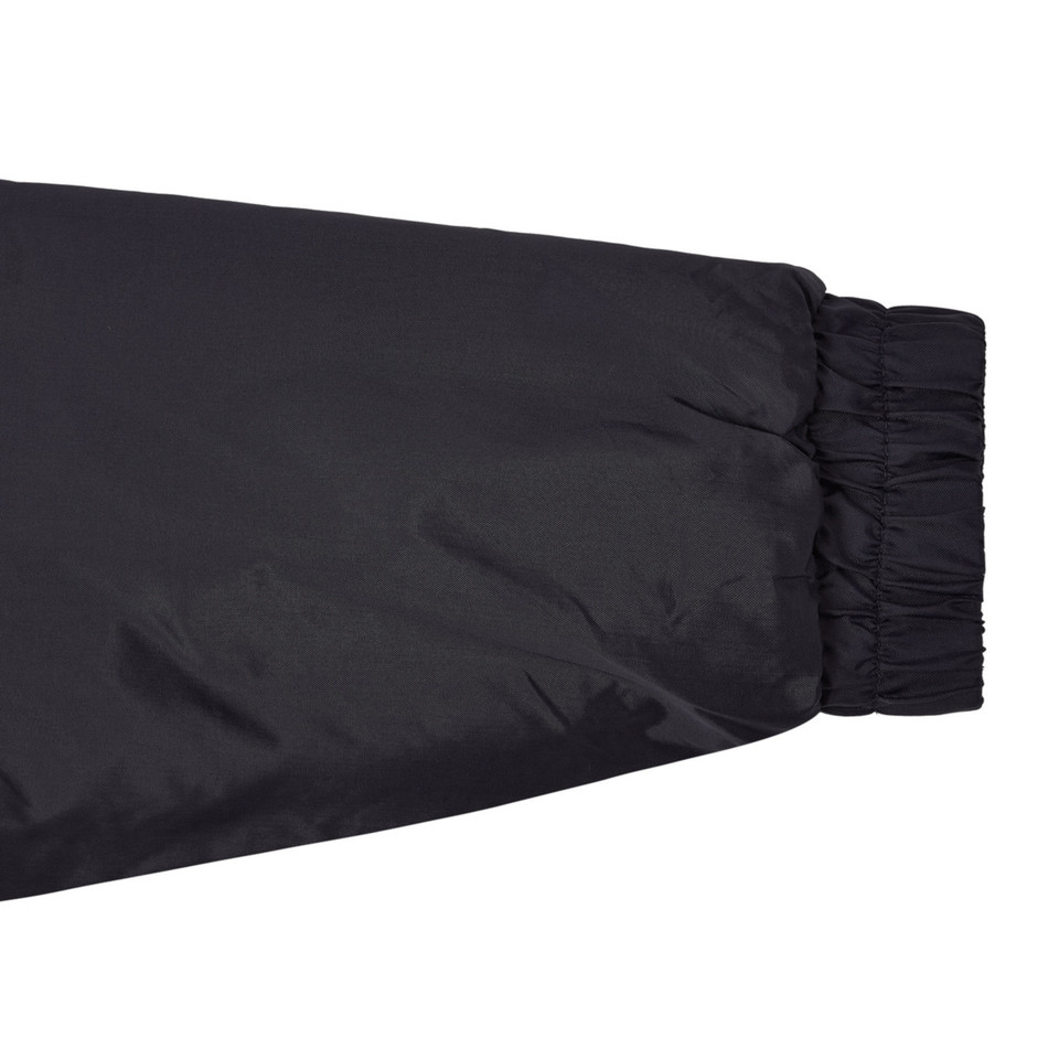 Black waterproof jacket sleeve with elasticated cuff and gathered hem detail