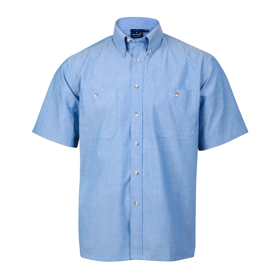 Light blue chambray short sleeve shirt with button-down collar, twin chest pockets, and gold-tone buttons