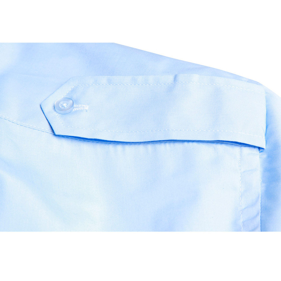 Light blue short sleeve shirt with buttoned shoulder epaulette detail and chest pocket