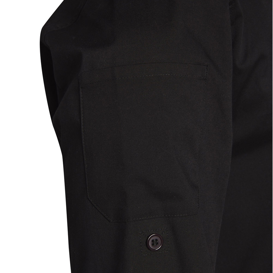 Close-up of black chef jacket sleeve with chest pocket and single button cuff detail