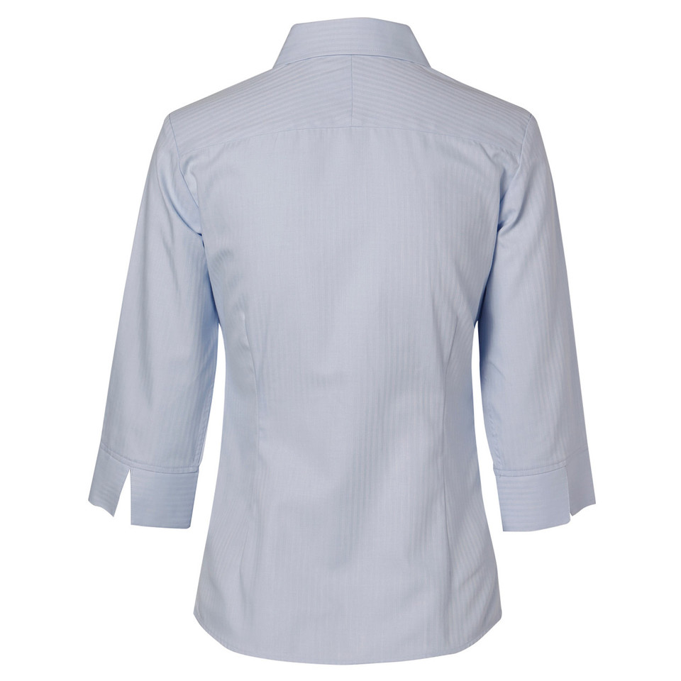 Back view of a pale blue mini herringbone ladies shirt with 3/4 sleeves, button cuffs, and textured woven fabric