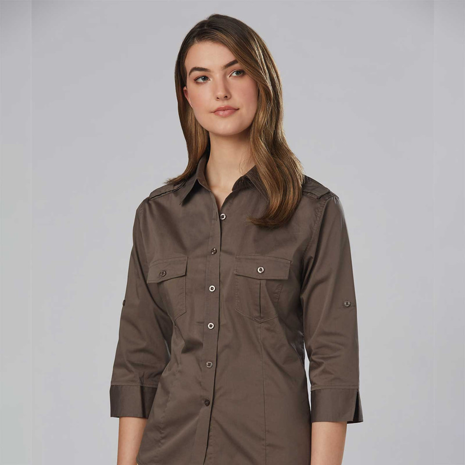 Khaki brown military-style shirt with dual chest pockets, button front, and three-quarter length sleeves with tab detail