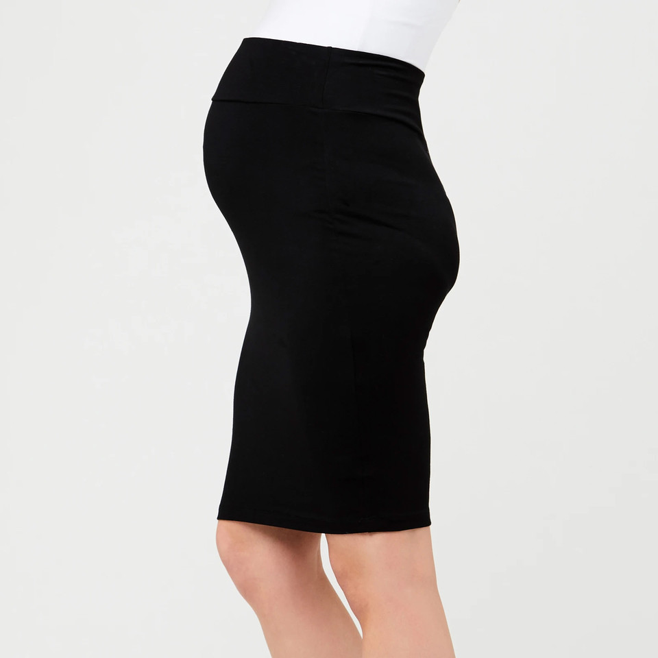 Model wearing black maternity pencil skirt with wide fold-over waistband, side profile view