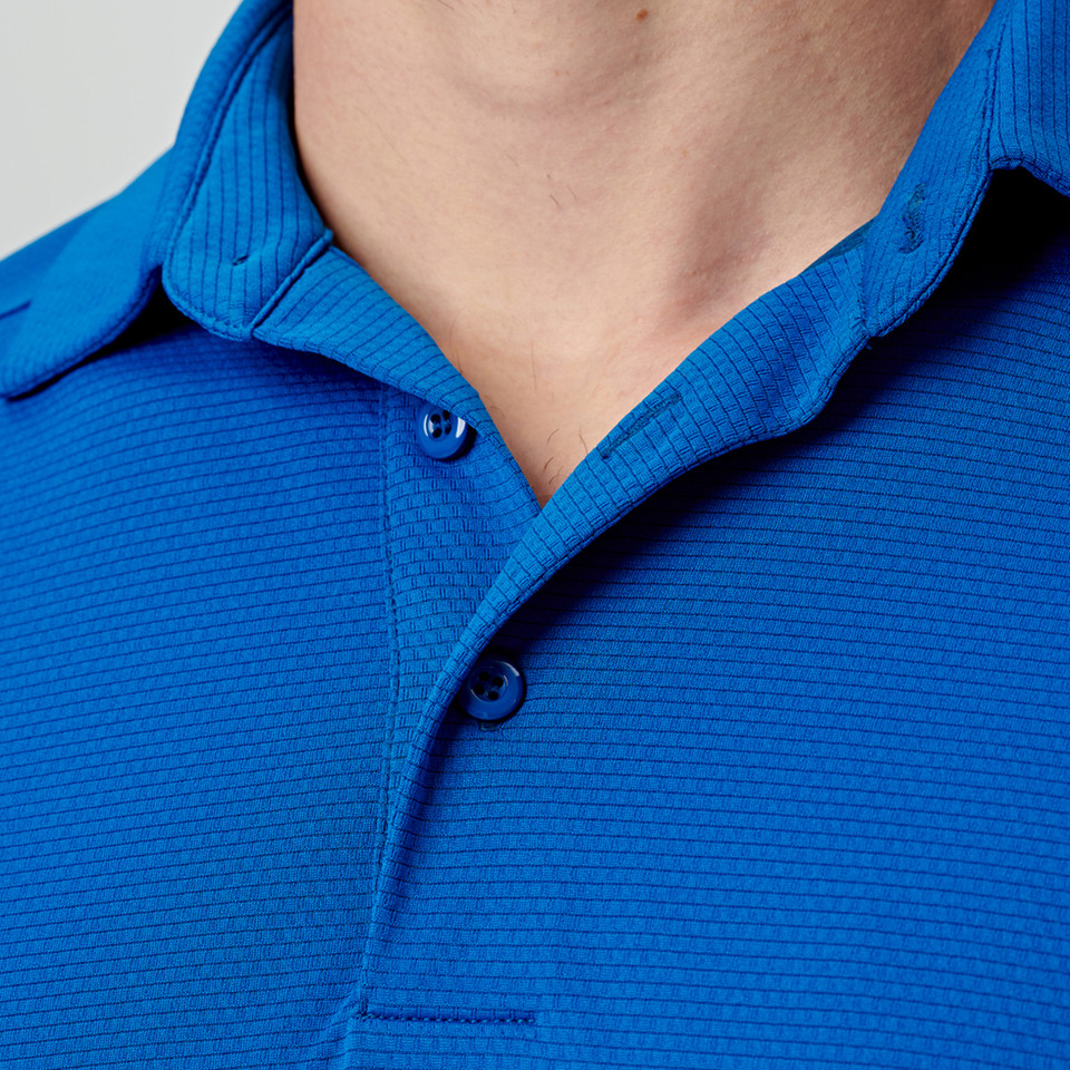 Royal blue short sleeve polo with textured stripe pattern and matching button placket