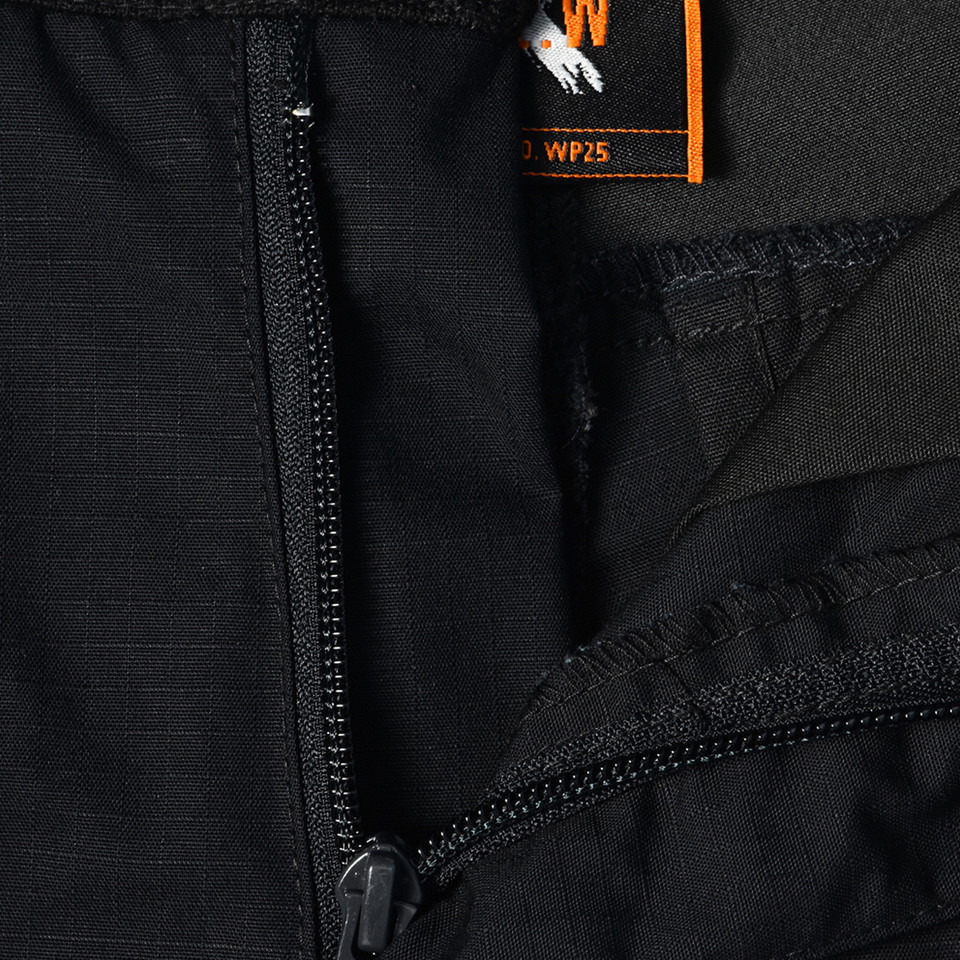 Black ripstop work shorts showing chunky zipper detail and orange WP25 label with contrast stitching