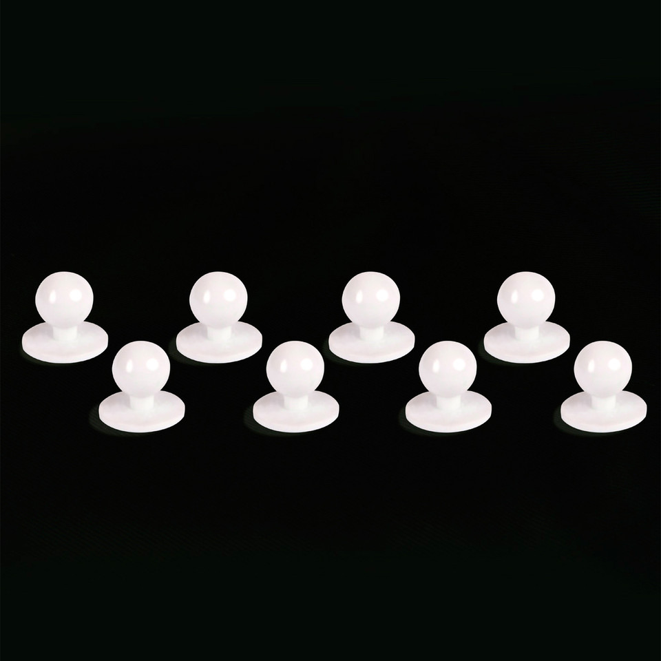 Eight white round chef jacket buttons with smooth domed tops arranged in two rows on black background