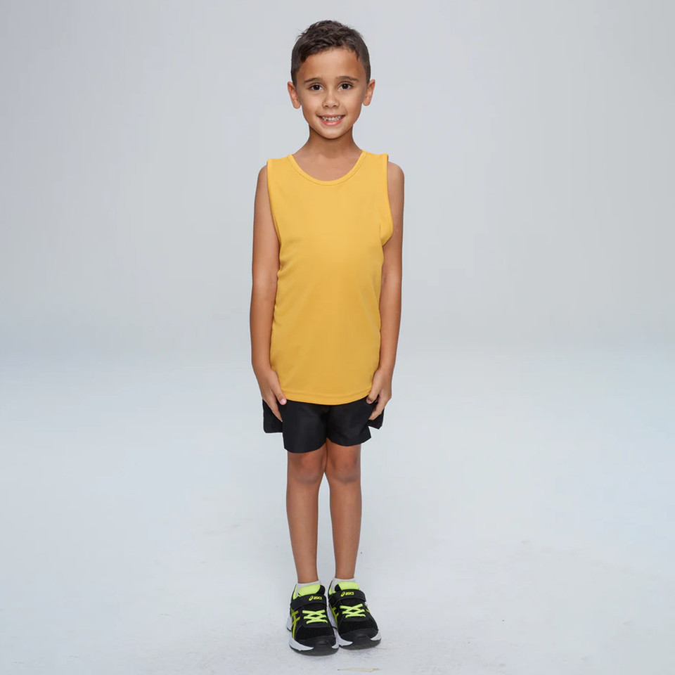 Child wearing a golden yellow sleeveless singlet with round neck and black shorts, front view