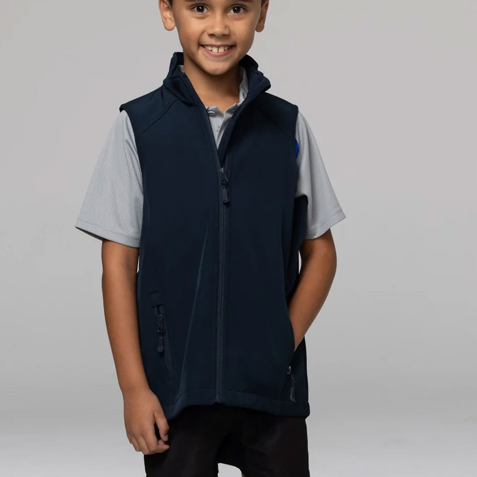 Boy wearing navy full-zip softshell vest with hood, side zip pockets and sleeveless cut