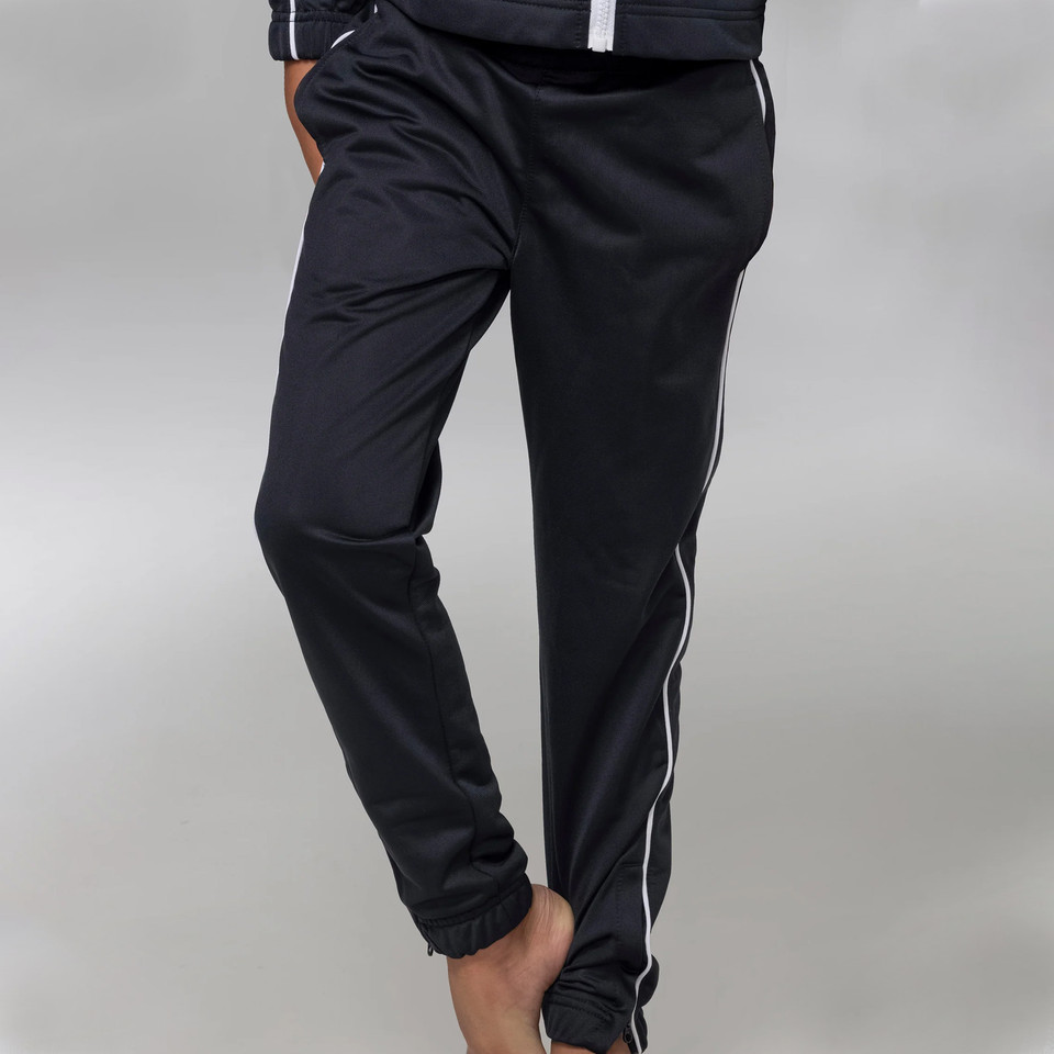 Black tracksuit pants with white contrast piping detail along sides and elasticated cuffs