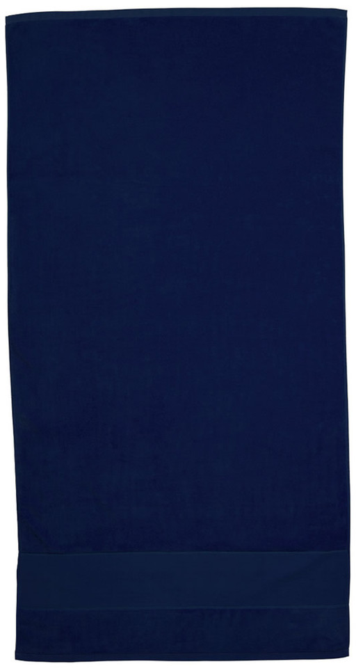 Navy blue velour beach towel with cotton construction laid flat showing textured pile surface