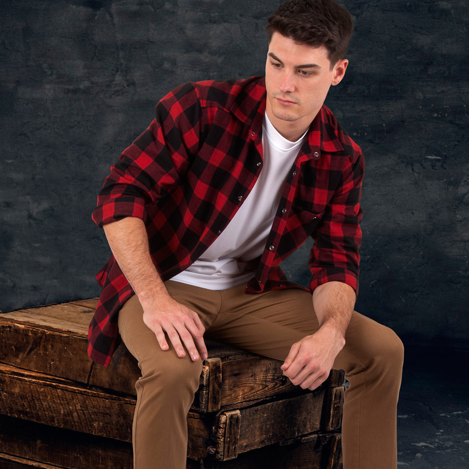 Red and black buffalo check flannel shirt worn open over white tee with button-down front and chest pocket