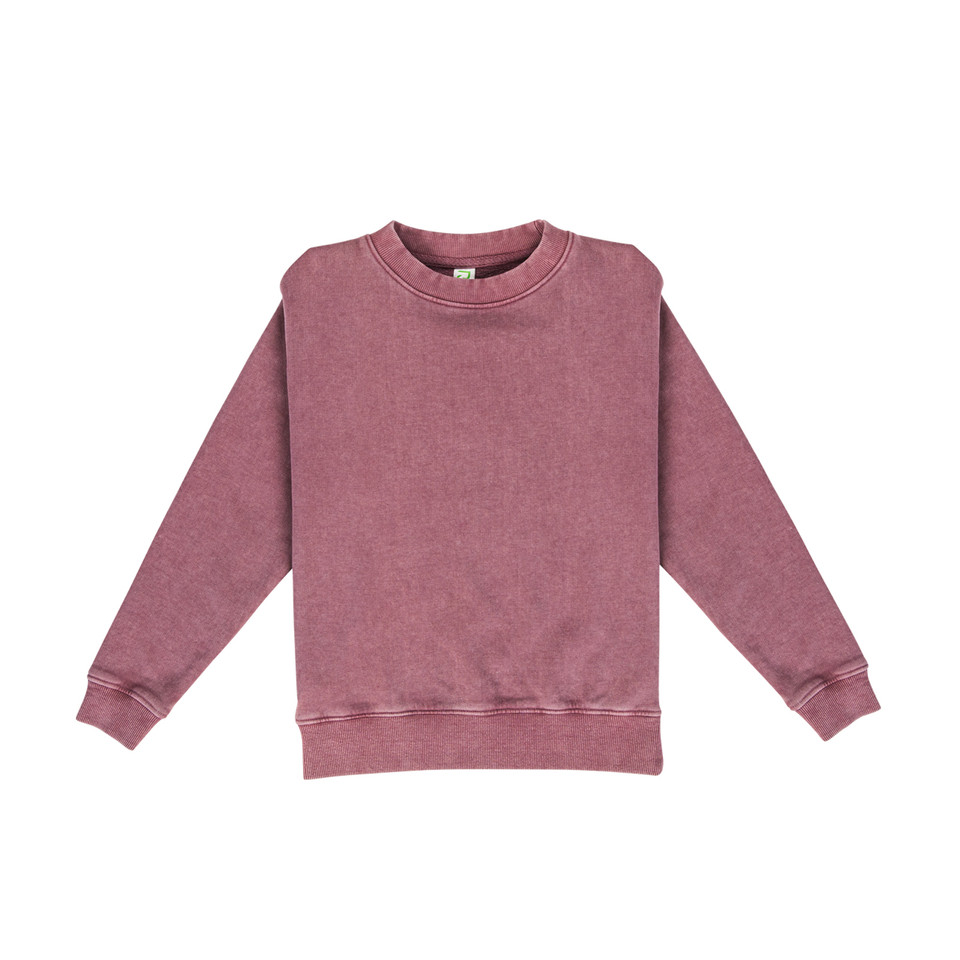 Dusty rose stonewashed crew neck sweater with ribbed cuffs and hem showing vintage-style pigment dye finish